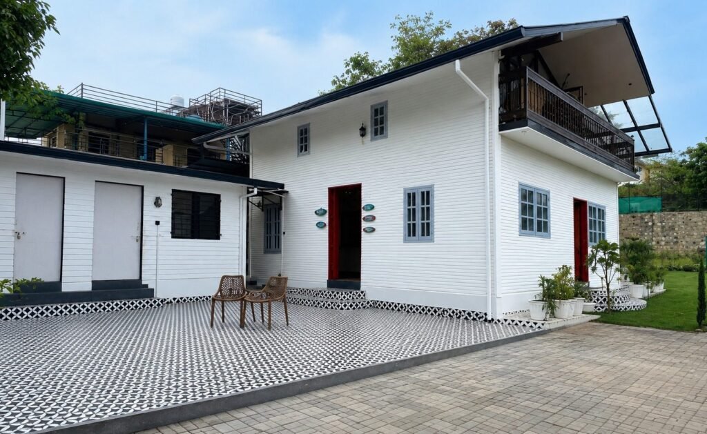 White villa facade with patio at Amar Villas Dehradun by Around Stays