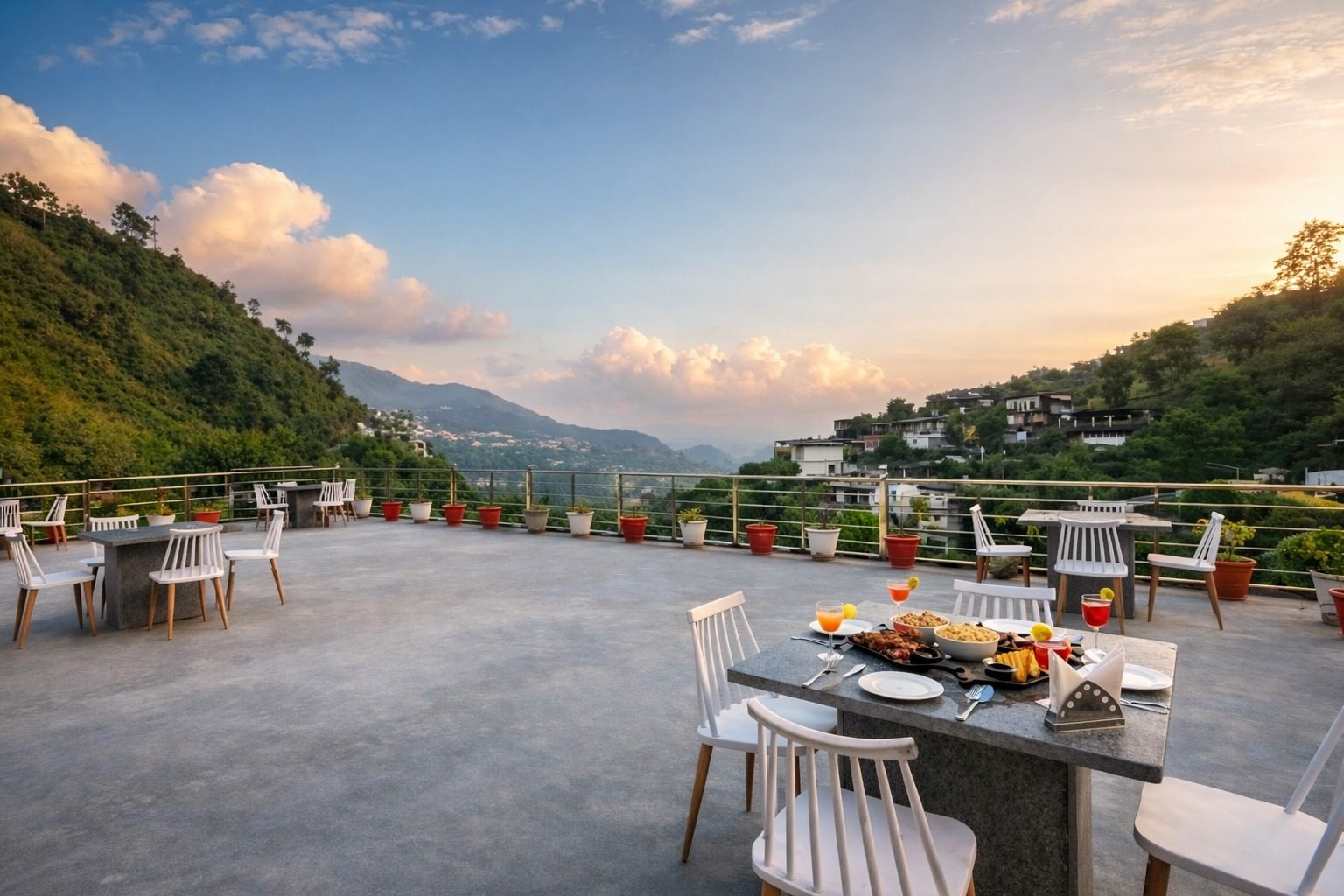 Rooftop terrace dining with a mountain panorama at sunset at an Around Stays property