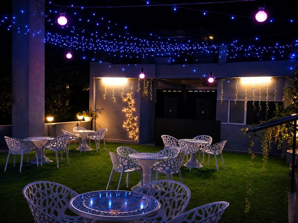 Rooftop garden with fairy lights at night at Hotel Foothill by Around Stays