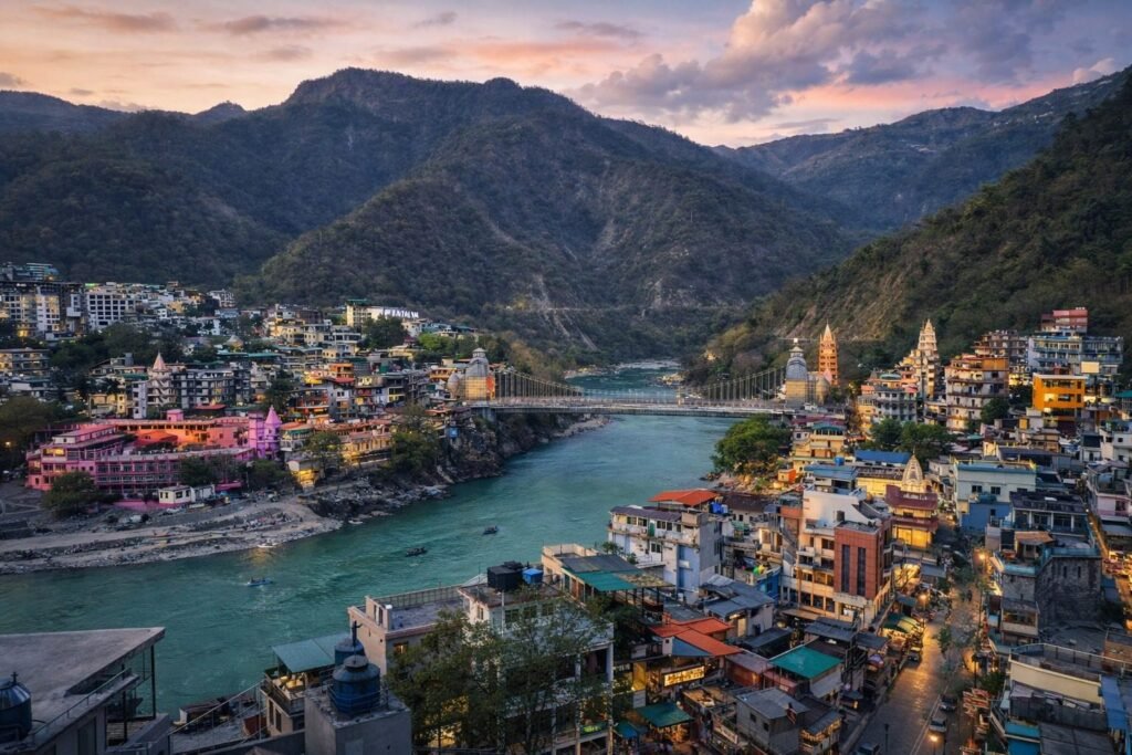 Ganga river and Rishikesh town at dusk at Rishikesh Heritage Resort by Around Stays