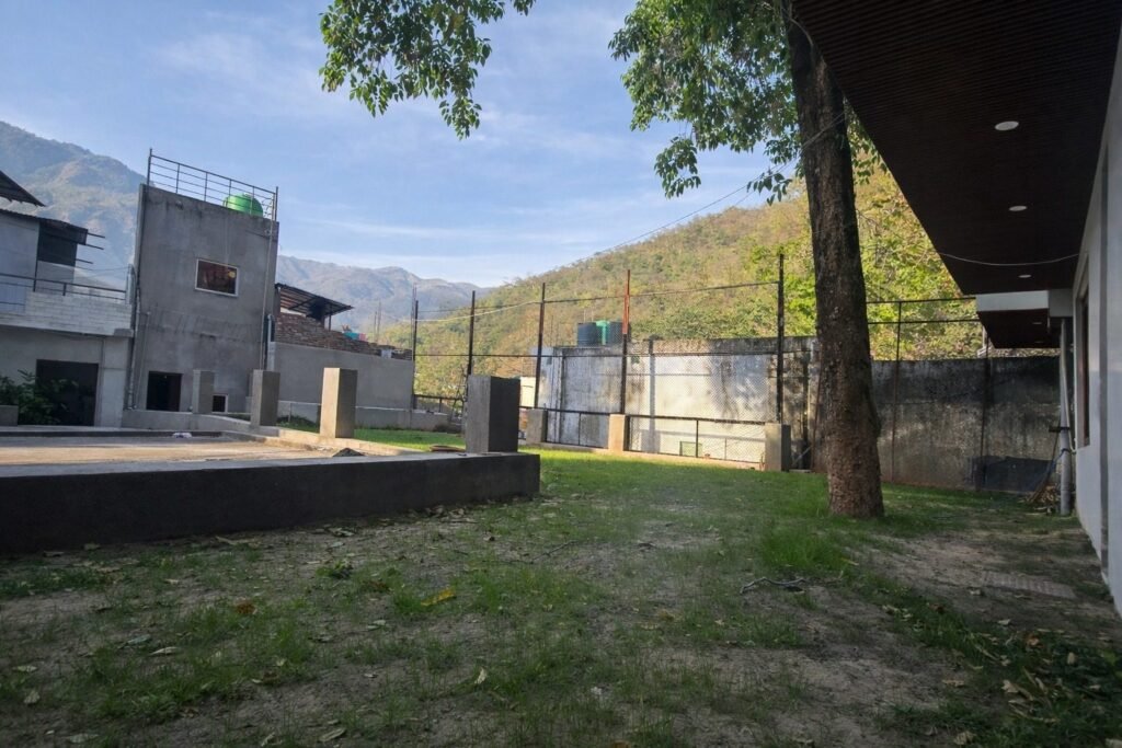 Building and garden lawn at The Great Garuda by Around Stays